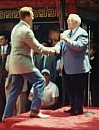 Arnold shaking Johnny Grant's hand