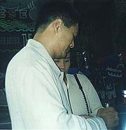 Chow Yun-Fat signing an autograph