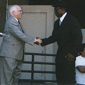 Wes shaking Johnny Grant's hand