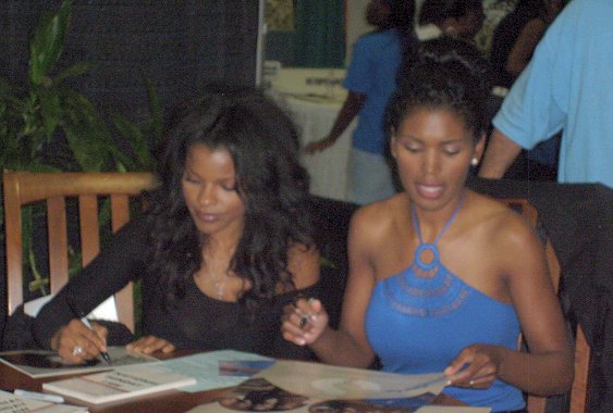 Keesha Sharp and Denise Boutte signing