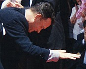 Tom bowing