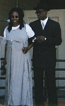 Whoopi and Wes locking arms